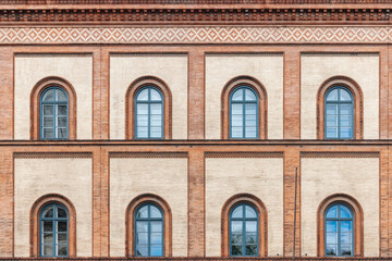 Wall Mural - Old Facade with round windows and brick wall in Munich, Germany