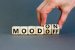 © Dzmitry - Mood on or off symbol. Businessman turns wooden cubes and changes word Mood off to Mood on. Beautiful grey table grey background. Business and mood on or off concept. Copy space.