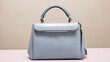 Beautiful trendy smooth youth women's handbag in gray color on a studio background, generative ai