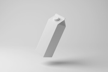 White drink carton floating in mid air with shadow on white background in monochrome. Illustration of the concept of pasteurized milk, juice and drink