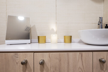 A cabinet with wooden doors, a sink