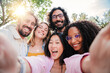 Group of multiracial young people smiling and taking a selfie together. Close up portrait of happy asian teenage woman laughing with his cheerful friends. Classmates having fun on friendly meeting