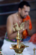 © robertharding - Sri Srinivasa Perumal Hindu temple, Hindu priest (Brahmin) performing puja ceremony and rituals, oil lamp, Singapore