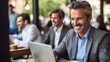 © wetzkaz - mature adult man, businessman with a promising career, at the laptop sitting in a cafe or restaurant, or digital nomad, having fun and enjoying working at the job