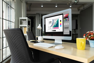 Graphic designer software for modern design of web page and commercial ads showing on the computer screen