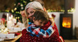 © K Louw/peopleimages.com - Christmas, love and a grandma hugging her grandchild in the home during the festive season together. Family, children or holiday with a young boy and senior woman in a house to hug while bonding