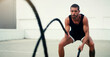 © Emil Lime/peopleimages.com - Man, fitness and battle ropes in training, exercise or workout for physical wellness outdoors. Fit, active and serious male person exercising with rope for intense body endurance, stamina or cardio