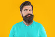 © be free - portrait of worried bearded man. portrait of bearded man isolated on yellow.