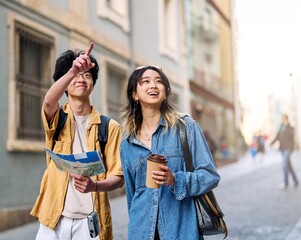 Wall Mural - city young woman travel tourist map couple happy vacation lifestyle holiday guide direction route lost navigation street summer urban tourism