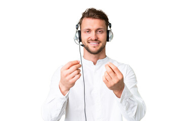 Wall Mural - Telemarketer caucasian man working with a headset over isolated chroma key background making money gesture