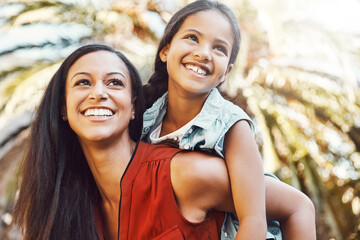 happy, outdoor and mother giving her child piggyback ride in the garden of the backyard of their hom