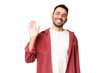 © luismolinero - Young handsome caucasian man over isolated chroma key background saluting with hand with happy expression