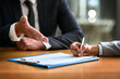 © Jadon B/peopleimages.com - Business people, hands and contract or signature for deal, partnership and legal paperwork, law firm and night office. Paper, client advice and lawyer person, notary or partner writing and agreement