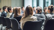 © JMarques - People sitting listening to a conference or business convention and presentation. Audience in a work, study or business conference room. Generative ai.