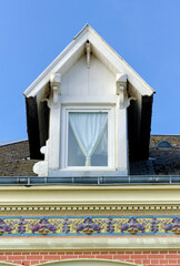 Wall Mural - architectural detail on a facade of a house in Saint Valery sur Somme in France