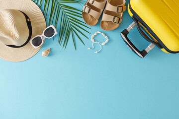 Sticker - Concept of summertime travel. Top view flat lay of yellow suitcase beach accessories and palm leaf on light blue background with empty area for text or promotion