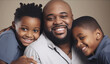 © LunaLu - African American man smiling with his children. Family enjoying time at home lifestyle concept. Generative AI
