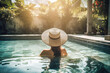 © TRINETTE + CHRIS - Beautiful woman on vacation in pool at luxury spa hotel in Bali.