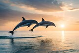 Fototapeta Dinusie - A playful pod of dolphins jumping out of the water