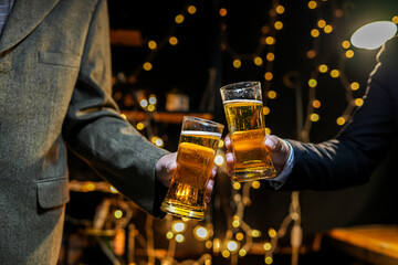 Wall Mural - food and drink male friends are happy drinking beer and clinking glasses at a bar or pub.