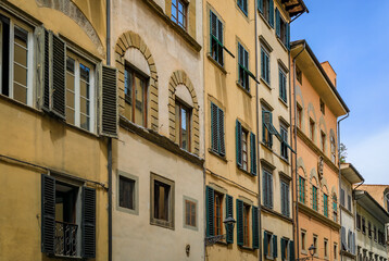 Poster - Gothic buildings on a narrow street in Centro Storico of Florence, Italy