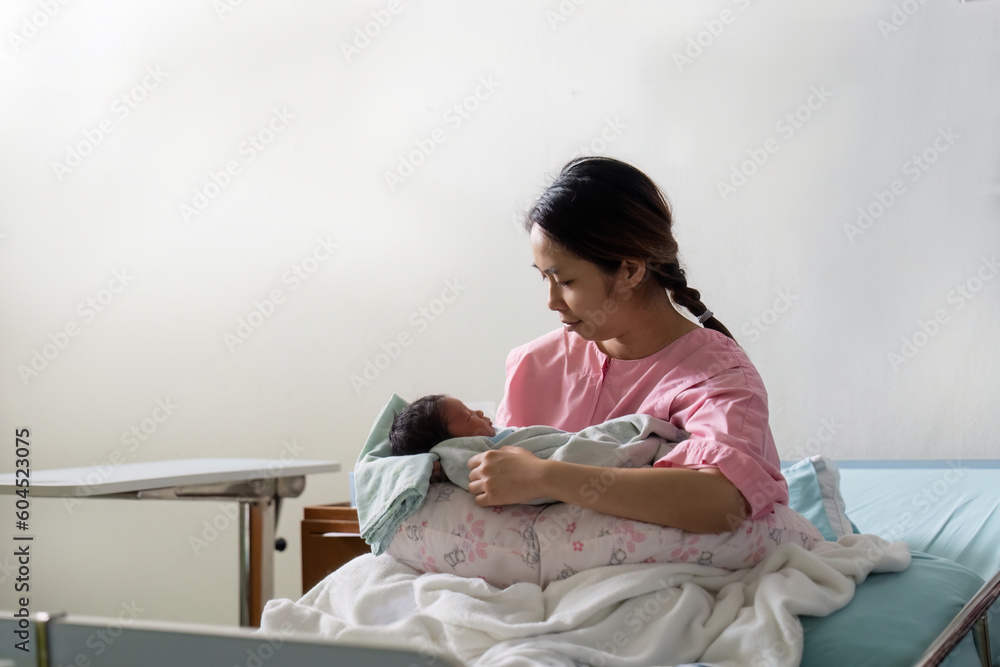 Mother gave birth to a child at the hospital. Stock Photo | Adobe Stock