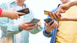 © metamorworks - Multinational youth group showing their smart phone. Social network. Mobile app.