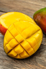 Wall Mural - Mango. Fresh tropical fruit on a wooden background. place for text, top view