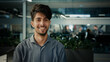 © Yuliia - Close-up confident indian arabian ethnic man team leader businessman standing in modern office successful proud male ceo agent entrepreneur professional manager satisfied smile career growth concept