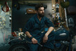 © Nomad_Soul - Portrait of confident man in overalls holding wrench while sitting on motorcycle