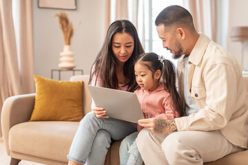 Wall Mural - Korean Parents And Baby Daughter Using Computer At Home