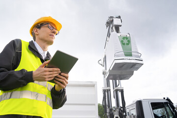 Sticker - Manager with a digital tablet next to garbage truck.	