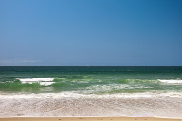 sail boat on the pacific coast wide format, sunny sailing