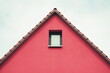 Red triangle tiled roof facade with window