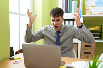 Poster - Young hispanic man business worker angry screaming at office