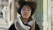© Krakenimages.com - Young african american woman standing with serious expression at street