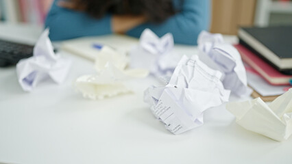 Poster - Young beautiful hispanic woman student stressed around crumpled paper at university classroom