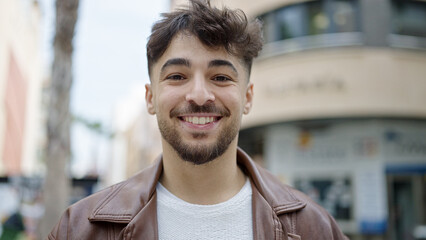 Canvas Print - Young arab man smiling confident standing at street