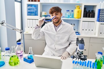 Sticker - Young arab man scientist using laptop working at laboratory