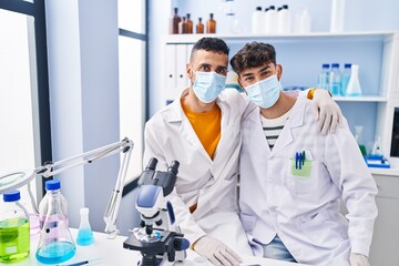 Canvas Print - Two man scientists wearing medical mask at laboratory