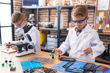 Poster - Adorable boys students playing with molecules toy at laboratory classroom