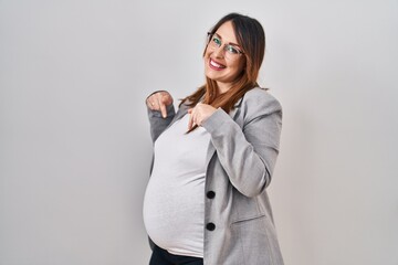 Poster - Pregnant business woman standing over white background looking confident with smile on face, pointing oneself with fingers proud and happy.