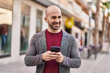 Sticker - Young man smiling confident using smartphone at street