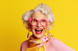 Portrait of a stylish fashionable cool extravagant adult grandma on a yellow background made with Generative AI technology