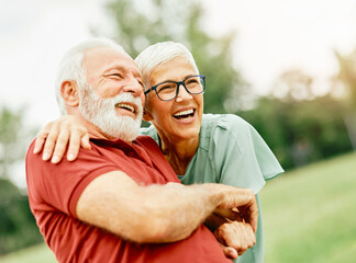 Wall Mural - woman man outdoor senior couple happy lifestyle retirement together smiling love fun elderly active vitality nature mature