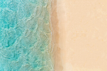 Wall Mural - Aerial top down view of beach and turquoise water. Ocean waves on the beach as a background. Beautiful natural summer vacation holidays background. Margaret River, Western Australia. Blue sea water