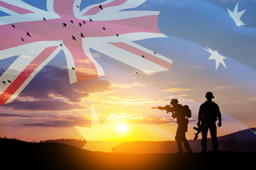 Wall Mural - Silhouettes of soldiers on background of Australia flag and the sunset or the sunrise background. Anzac Day.