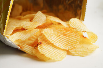 Potato chips in open bag, delicious BBQ seasoning spicy for crips, thin slice deep fried snack fast food.