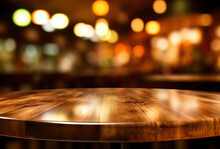Empty Wooden Round Table And Pub Or Bar Blur Background With Bokeh Light.