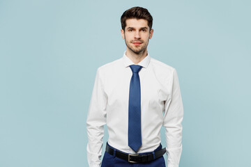 Young serious calm caucasian successful employee business man corporate lawyer wear classic formal shirt tie work in office look camera isolated on plain pastel light blue background studio portrait.